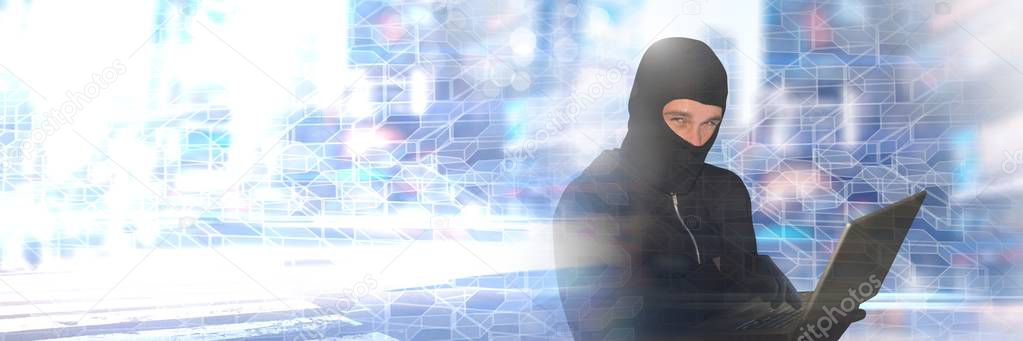 Digital composite of Hacker in balaclava on laptop with geometric transitions