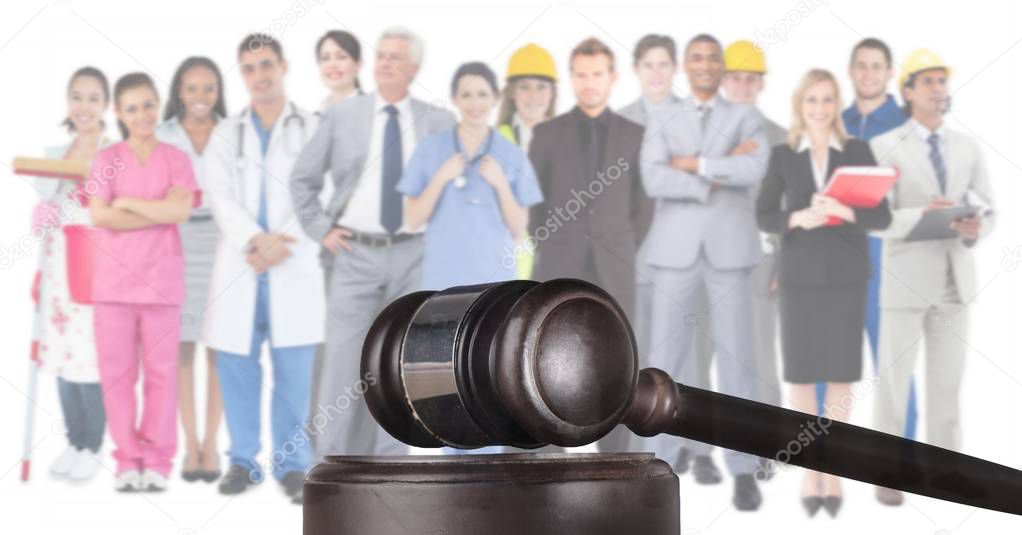 Digital composite of Gavel and people working in various professions