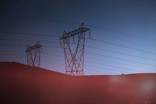 Silhouette Del Traliccio Elettrico Della Sera — Foto Stock