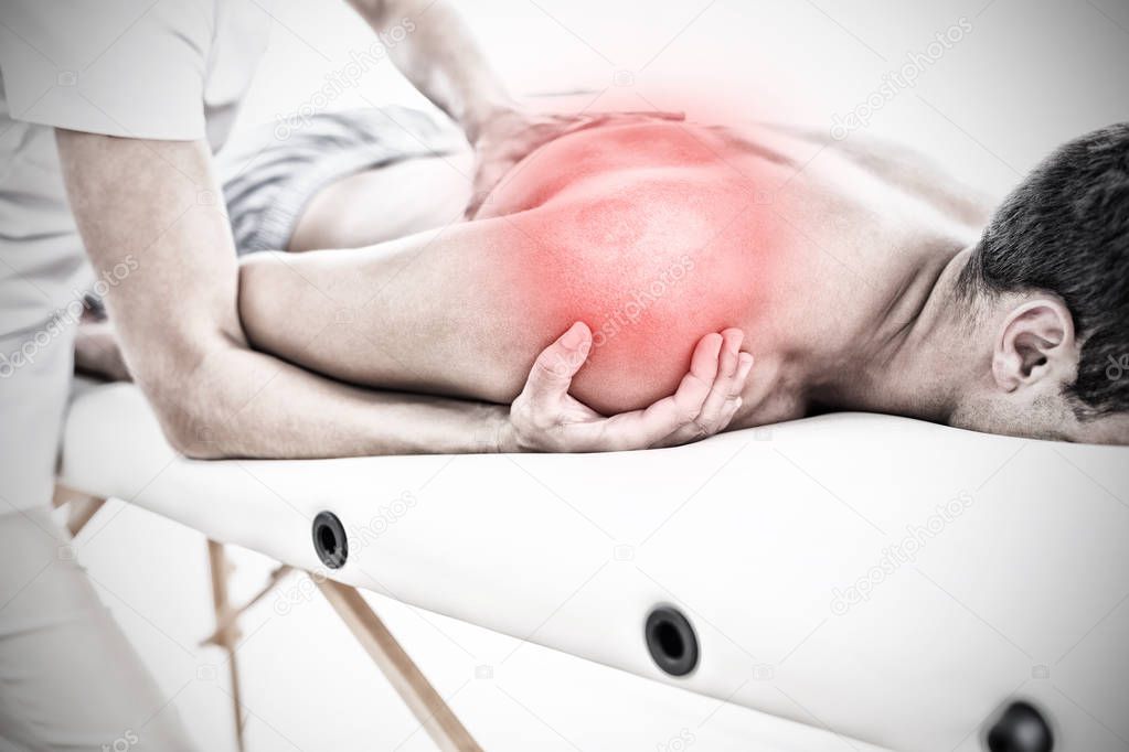 Highlighted pain against physical therapist examining massaging