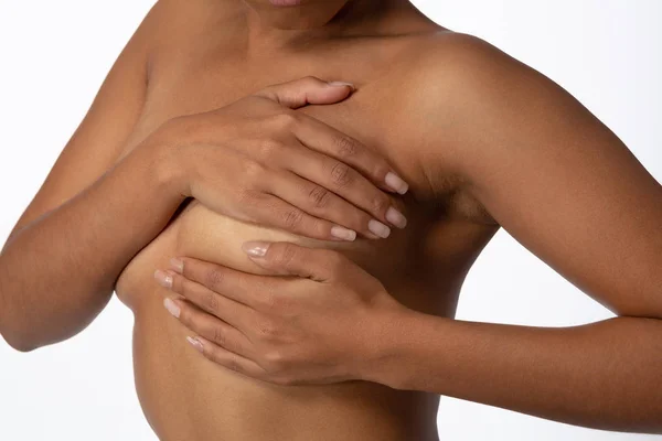 Shirtless woman for breast cancer awareness on white background