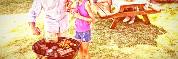 Grandfather Granddaughter Preparing Barbecue While Family Having Meal Background — Stock Photo, Image