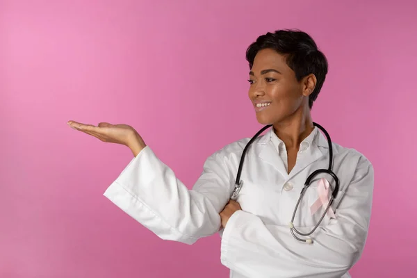 Nurse Wearing Breast Cancer Awareness Pink Ribbon Shows Copy Space — Stock Photo, Image