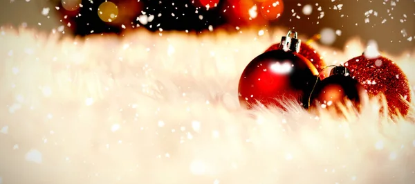 Snow Falling Red Christmas Balls White Fur — Stock Photo, Image