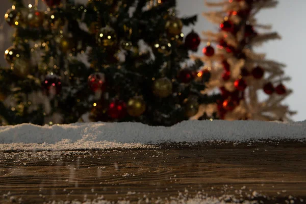 Wooden Table Snow Unfocused Christmas Tree — Stock Photo, Image