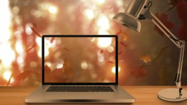 Dijital olarak oluşturulan video-in belgili tanımlık laptop karşı düşen sonbahar yaprakları 