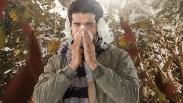 Vídeo Compuesto Digital Hojas Otoño Cayendo Hombre Estornudando Mientras Sufre — Vídeo de stock