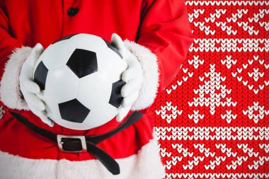 Noel Baba Noel arka plan kar taneleri örgü kırmızı karşı bir futbol holding
