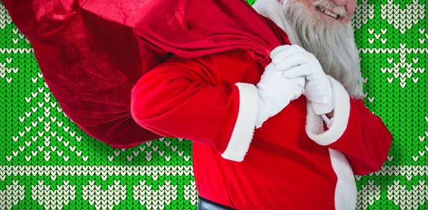 Papai Noel Segurando Saco Natal Contra Papel Parede Padrão Natal — Fotografia de Stock
