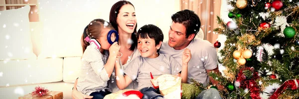 Happy Family Playing Christmas Gifts Snow Falling — Stock Photo, Image