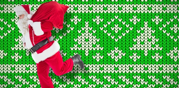Санта Клаус Идет Мешком Против Белого Зеленого Узоров — стоковое фото