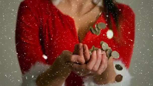 数字复合的视频组成与降雪在女孩在圣诞老人的西装牵手 — 图库视频影像