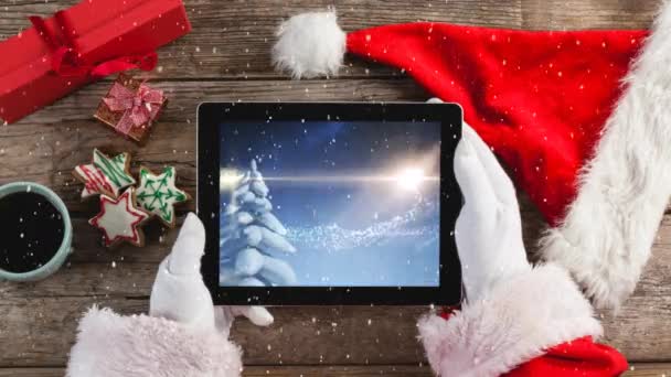 Video Composition Snow Top View Santa Holding Tablet — Stock Video