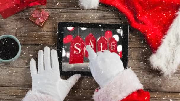 サンタ手のラップトップ上で机の上の雪で映像の合成 — ストック動画