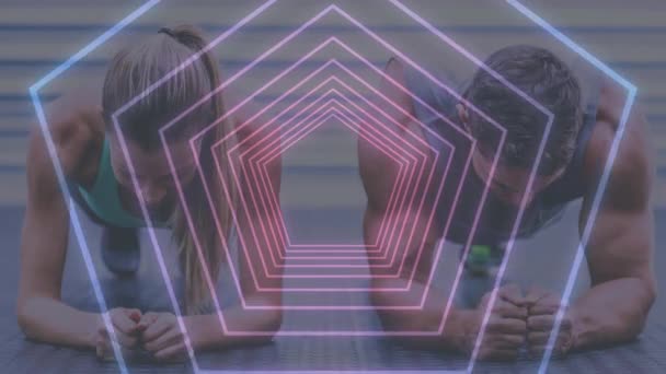 Digital composite of fit couple exercising in fitness studio — Stock Footage Digital Composite Fit Couple Exercising Fitness Studio Stock Footage