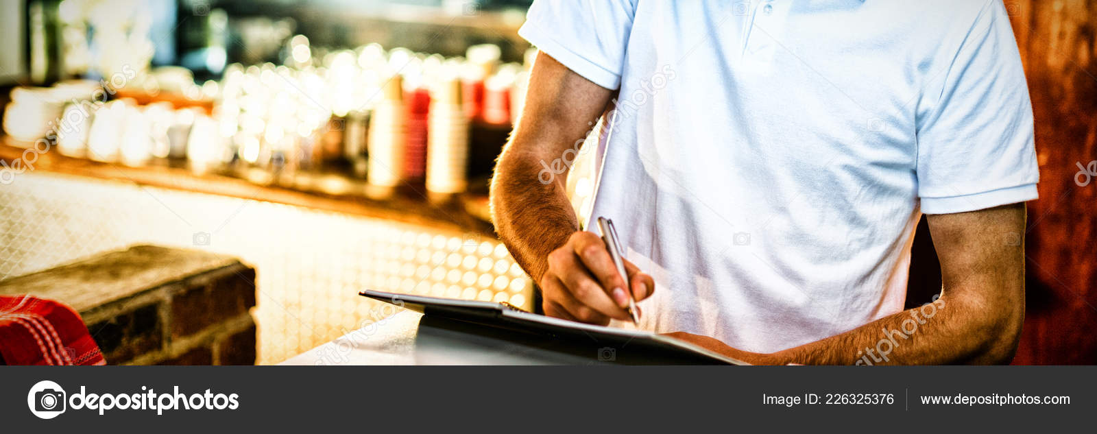 Pizza Delivery Man Taking Order Phone Counter Restaurant Stock Photo by