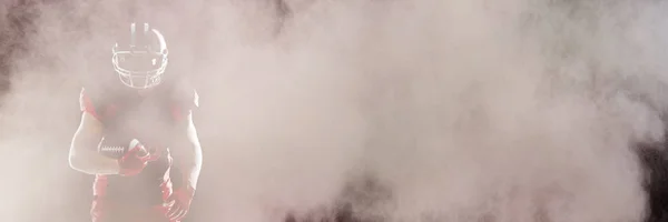 Splashing Polvere Colore Contro Giocatore Football Americano Casco Prendendo Posizione — Foto Stock