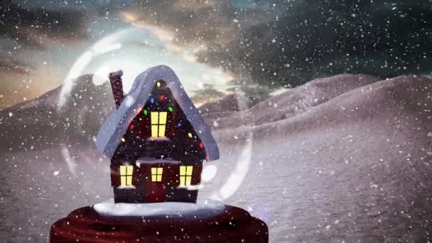 雪球中雪屋的圣诞动画 雪在雪山上飘落 — 图库视频影像