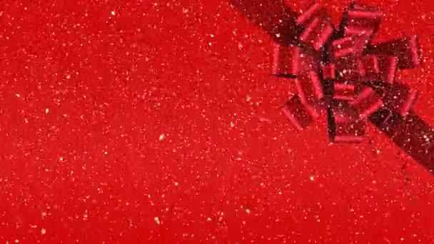 Digitální Animace Červenou Stuhou Mašlí Dárkové Červené Pozadí Sníh Padá — Stock video