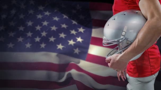 数字动画橄榄球球员与头盔站立反对美国旗子 美国国旗在背景中摇曳 — 图库视频影像
