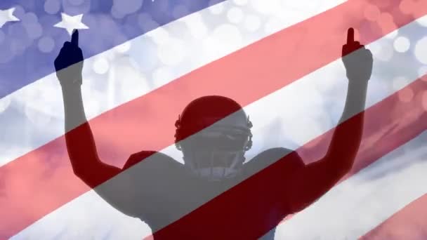 胜利的橄榄球运动员的数字动画 双手举起手来 靠在美国国旗上 美国国旗在风中摇曳 — 图库视频影像