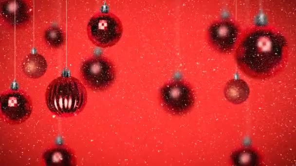 Digital Animering Julgranskulor Mot Röd Bakgrund Snö Faller Förgrunden Vintern — Stockvideo