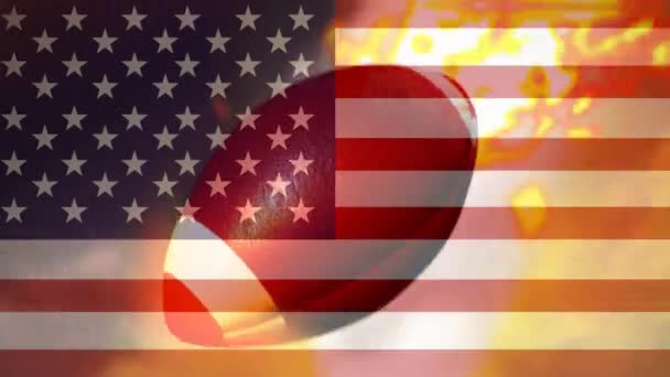 デジタル アニメーションと移動するラグビー ボールの発射炎 アメリカの国旗を背景に揺れる — ストック動画