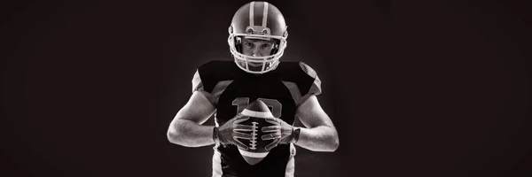 American Football Player Helmet Holding Rugby Ball Black Background — Stock Photo, Image