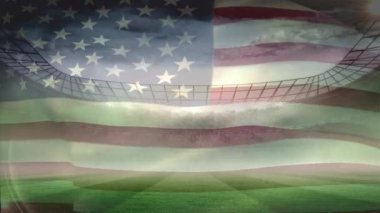 Amerikan bayrağı futbol stadyumu arka plan karşı rüzgarda üfleme