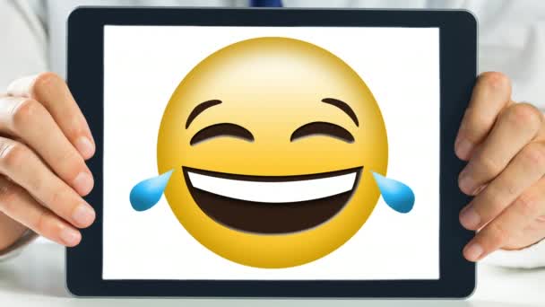 Hands Holding Digital Tablet Screen Showing Emoticon Laughing Hard Its — Stock Video