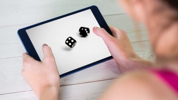 Woman Holding Digital Tablet Showing Animated Dices Table Background — Stock Video