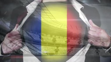 Romanya bayrağı ile kar hareketli futbol stadyumu arka plan karşı gösterilen işadamı açılış gömlek