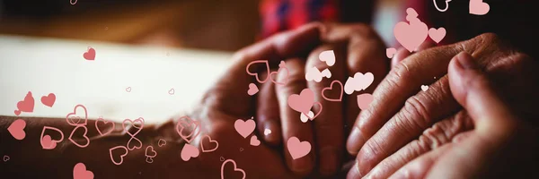 Walentynki Serca Wzoru Przeciwko Starszy Para Trzymając Się Ręce — Zdjęcie stockowe