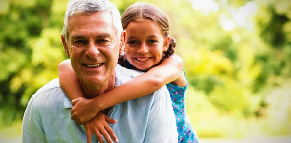 Smiling Grandfather Carrying Granddaughter Yard — Stock Photo, Image
