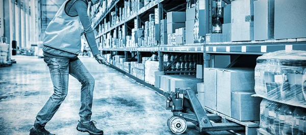 Worker Pushing Trolley Boxes Warehouse — Stock Photo, Image