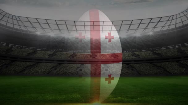 フィールドを背景にストライクのイングランド ラグビー ボールの正面図 — ストック動画