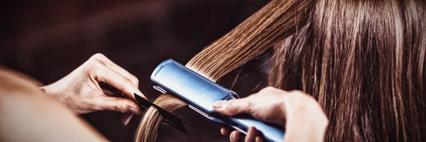 Female Hairdresser Straightening Hair Client Salon — Stock Photo, Image