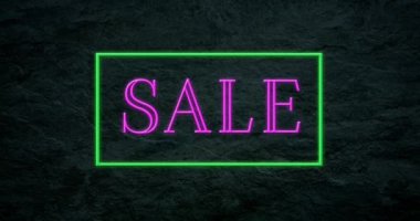 Karanlık bir arka plan 4k yeşil bir çerçevedeki pembe köpüklü animasyon satışı metin