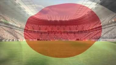 Büyük stadyum destekçileri ve fan ön plan üzerinde sallayarak bir Japon bayrağı ile dolu dijital bileşik
