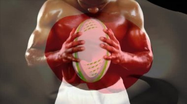 Dijital bileşkesi rugby topu tutarak ve ön plan üzerinde sallayarak bir Japon bayrağı ile çığlık yakışıklı gömleksiz Afro-Amerikan erkek rugby oyuncusu 