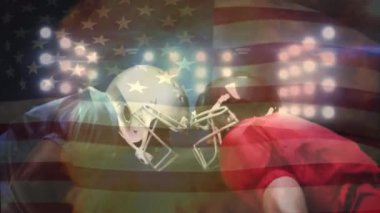Ön plan üzerinde dijital bileşik farklı futbolcuların dijital ateş yakıyor iken yüz yüze ayakta ve Amerikan bayrağı sallıyor