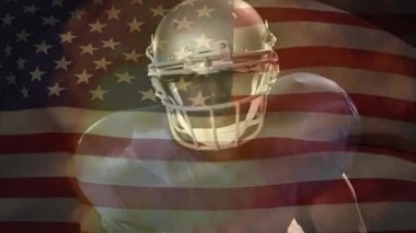 Bekleyen ve animasyonlu bir ateş ve bir Amerikan bayrağı sallayarak üzerinde ön kameraya bakarak bir Afro-Amerikan futbol oyuncunun dijital bileşik 