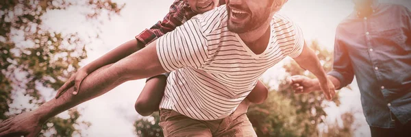 Happy Grandfather Looking Man Giving Piggy Backing Son Arms Outstretched — Stock Photo, Image