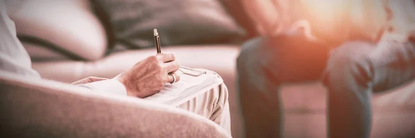 Therapist Making Notes Patient Sofa Home — Stock Photo, Image