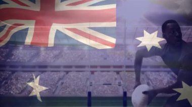 Afro-Amerikan rugby oyuncusu futbol atmadan aşağı beyaz rugby oyuncusu ve Avustralya bayrağı ön planda stadyum üzerinde sallayarak çalışmalarla sırasında dijital bileşik