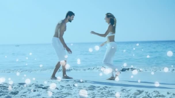 Digital Composite Young Caucasian Couple Enjoying Beach Surrounded White Bubbles — Stock Video