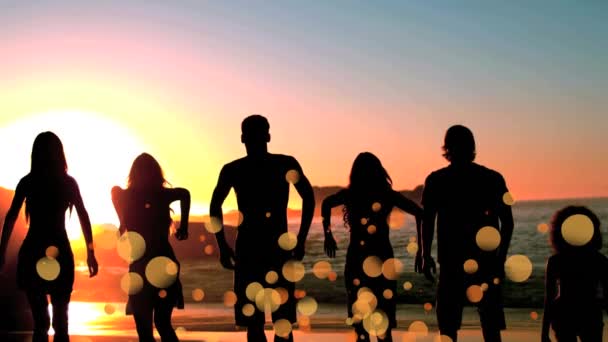 Digital Composite Happy Friends Jumping Beach Sunset Surrounded Yellow Bokeh — Stock Video