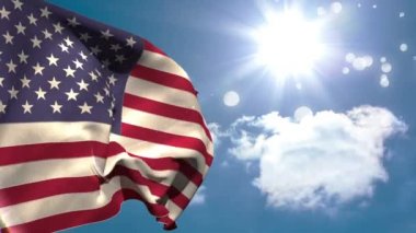 Bokeh ışıkları ile parlak güneşli gökyüzü altında sallayarak Amerikan bayrağı yakın