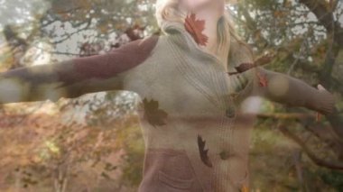 Ağaçların altında dans eden ve yaprakları düşen bir kadının dijital bileşimi. Mutlu görünüyor..