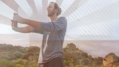 Saçları topuz gibi esneyen ve kollarını sallayan Kafkas bir adamın dijital bileşimi. Arka planda güneş ışını etkileri görülebilir ve ön planda daire ışık efektleri görülebilir